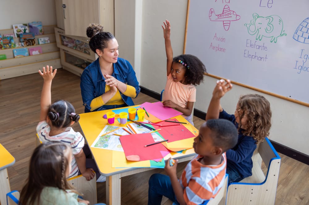 Students engaged in circle timewith the teacher in  safe supportive environment